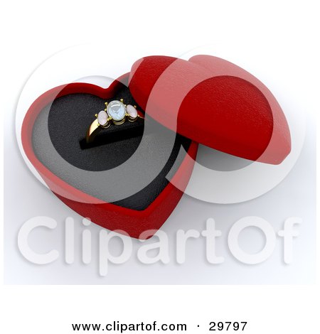 Gold Diamond Wedding Or Engagement Ring Resting In An Open Red Heart Shaped
