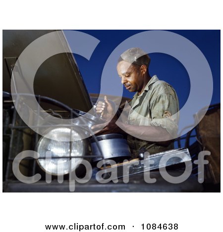 African American Mechanic Working on an Air Filter - Free Stock Photography by JVPD
