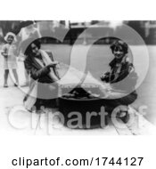 Black And White Photograph Of Ladies With Pet Ducks In A Tub On A Sidewalk