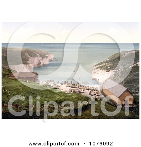 Boats And Huts On The Beach On The North Sea Landing In Flamborough Yorkshire England Uk - Royalty Free Stock Photography  by JVPD