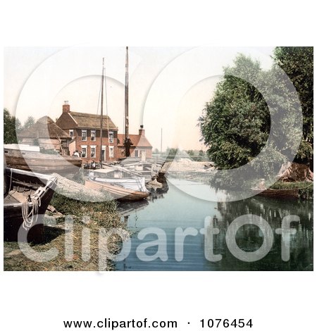 Boats at the Staithe Wharf on the River Thurne in Potter Heigham, Norfolk, England - Royalty Free Stock Photography  by JVPD