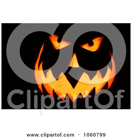 Candles Burning Inside A Scary Jack o'lantern Face - Royalty Free Halloween Stock Photo by Kenny G Adams