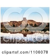 Factory At The Base Of A Butte Reflecting In Green River Utah Royalty Free Historical Stock Photo by JVPD