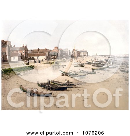 Historical Boats on the Beach, the Esplanade and the Pier in Redcar North Yorkshire England UK - Royalty Free Stock Photography  by JVPD