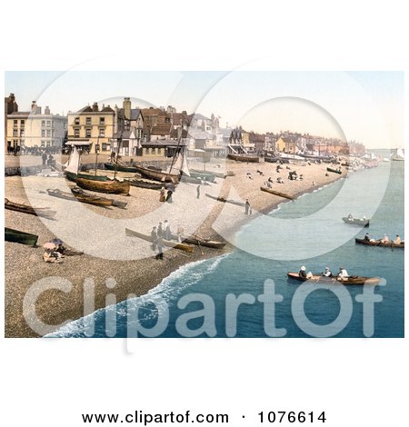 Historical Boats on the Shore and Buildings Along the Waterfront at Deal Kent England - Royalty Free Stock Photography  by JVPD