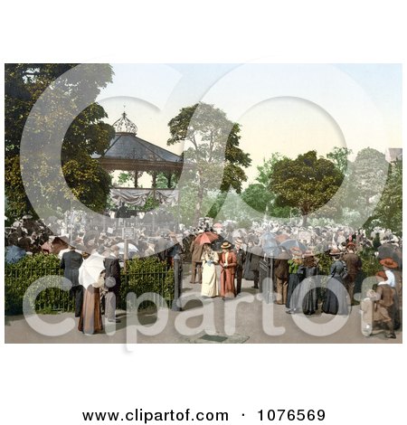 Historical People Enjoying Band Playing Music in a Gazebo in the Harrogate Valley Gardens North Yorkshire, England - Royalty Free Stock Photography  by JVPD