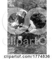 05/09/2022 - Historical Photograph Of A Kwakiutl Man Holding A Mummy