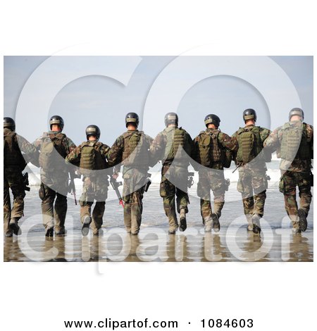 Line Of Soldiers Walking Away Towards The Surf On A Beach - Free Stock Photography by JVPD