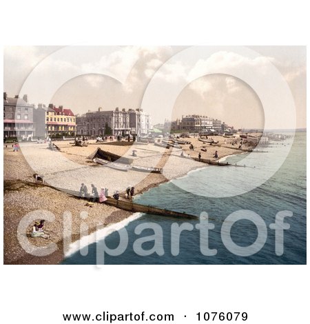 People, Boats And Bathing Machine Carts On The Beach In Worthing West Sussex England UK - Royalty Free Stock Photography  by JVPD