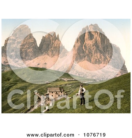 People Near a Hotel and Mountains, Sella Joch and Langkofl, Tyrol, Austria - Royalty Free Stock Photography  by JVPD