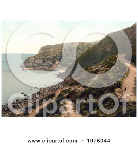 People Walking on a Road Above Babbacombe Beach in Torquay Torbay Devon England UK - Royalty Free Stock Photography  by JVPD