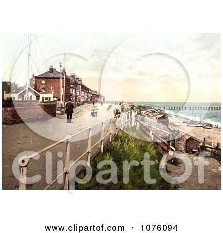People Walking On The Parade Promenade Near The Coast Guard Station In Southwell England - Royalty Free Stock Photography  by JVPD