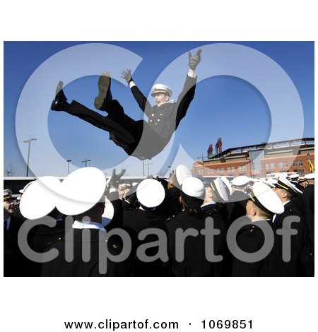 Photo Of An American Military Navy Man Thrown Into The Air During Celebration At A Football Game - Royalty Free Sports Stock Photography by JVPD