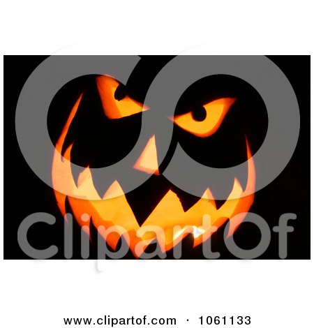 Photo Of Candle Burning Inside A Carved Pumpkin - Royalty Free Halloween Stock Photography  by Kenny G Adams