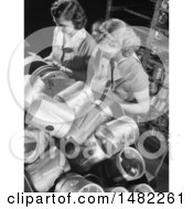Photo Of Two Women Working War Jobs While Inspecting Piston Heads In A Factory