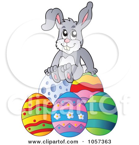 Royalty-Free Vector Clip Art Illustration of an Easter Bunny Sitting On Eggs by visekart