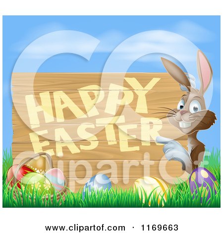 Cartoon of a Brown Bunny Pointing to a Happy Easter Sign, with a Basket and Easter Eggs in Grass - Royalty Free Vector Clipart by AtStockIllustration