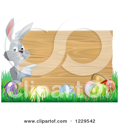 Clipart of a Gray Bunny Pointing to a Wood Sign with Grass and Easter Eggs - Royalty Free Vector Illustration by AtStockIllustration