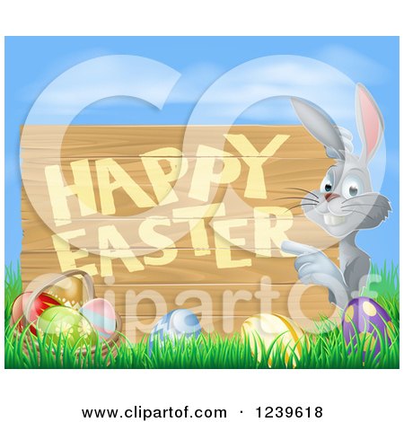 Clipart of a Happy Gray Bunny Rabbit Pointing to a Happy Easter Sign over Eggs, Grass and Sky - Royalty Free Vector Illustration by AtStockIllustration