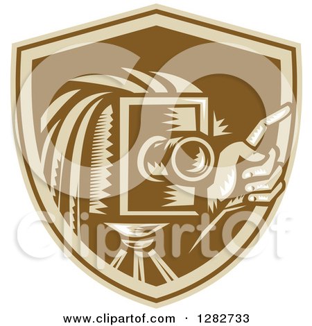 Clipart of a Retro Woodcut Male Photographer Holding up a Finger and Using a Vintage Camera in a Brown Shield - Royalty Free Vector Illustration by patrimonio