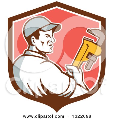 Clipart of a Retro Male Plumber Holding a Monkey Wrench and Looking to the Side in a Brown White and Red Shield - Royalty Free Vector Illustration by patrimonio