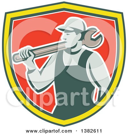Clipart of a Retro Male Mechanic Holding a Giant Wrench over His Shoulder in a Green Yellow White and Red Shield - Royalty Free Vector Illustration by patrimonio