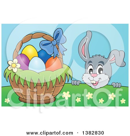 Clipart of a Happy Gray Easter Bunny Rabbit Peeking over a Hill at a Basket of Eggs - Royalty Free Vector Illustration by visekart