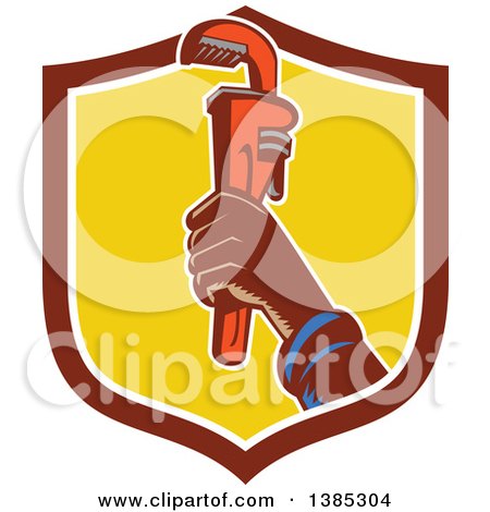Clipart of a Retro Woodcut Plumbers Hand Holding up a Monkey Wrench in a Shield - Royalty Free Vector Illustration by patrimonio