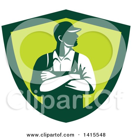 Clipart of a Retro Male Farmer with Folded Arms, Looking to the Side in a Green Shield - Royalty Free Vector Illustration by patrimonio