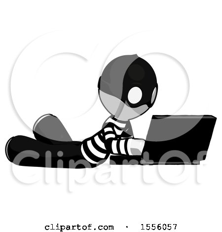 White Thief Man Using Laptop Computer While Lying on Floor Side Angled View by Leo Blanchette