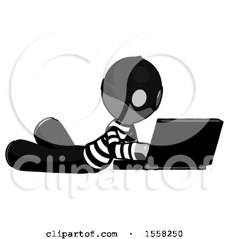 Gray Thief Man Using Laptop Computer While Lying on Floor Side Angled View by Leo Blanchette