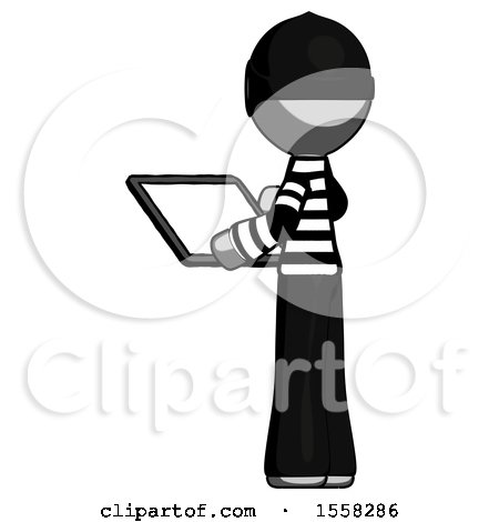 Gray Thief Man Looking at Tablet Device Computer with Back to Viewer by Leo Blanchette