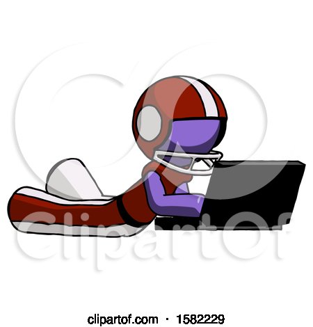 Purple Football Player Man Using Laptop Computer While Lying on Floor Side Angled View by Leo Blanchette
