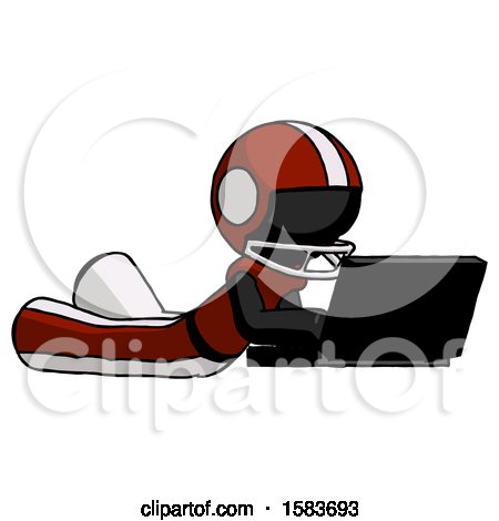 Black Football Player Man Using Laptop Computer While Lying on Floor Side Angled View by Leo Blanchette