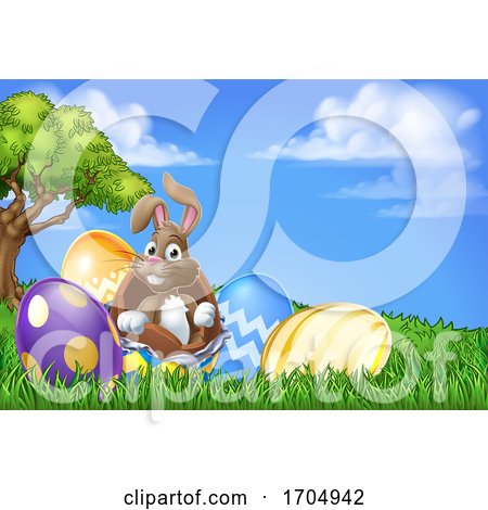 Easter Bunny Rabbit Breaking out of Egg Cartoon by AtStockIllustration
