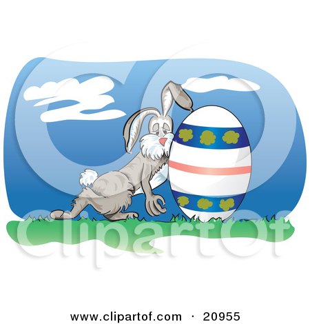 Clipart Picture of an Exhuasted Bunny Rolling A Decorated Easter Egg On Grass by Paulo Resende
