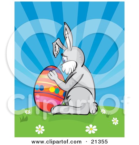 Clipart Illustration of a Lonely Easter Bunny Hugging A Colorful Easter Egg On Top Of A Hill With Spring Flowers Against A Blue Sky by Paulo Resende