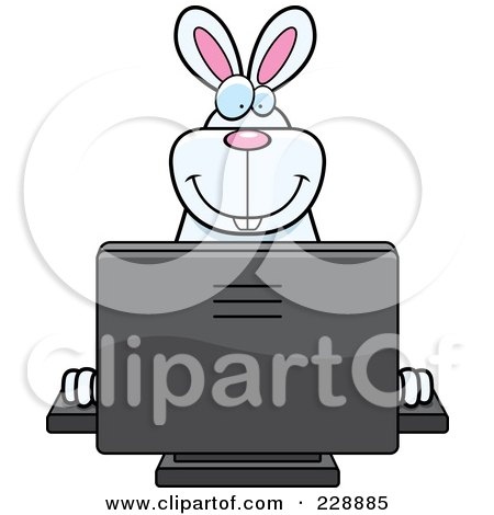 Royalty-Free (RF) Clipart Illustration of a Rabbit Using A Desktop Computer by Cory Thoman
