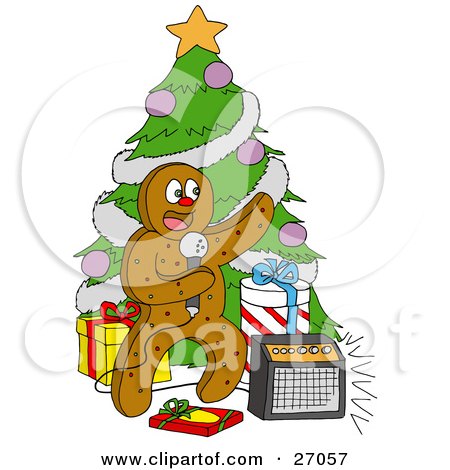 Clipart Illustration of a Festive Gingerbread Man Standing In Front Of A Christmas Tree With Gifts, Singing Karaoke by LaffToon