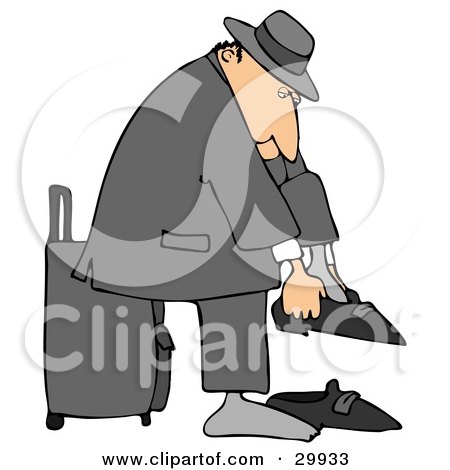 Clipart Illustration of a White Traveling Businessman Standing In Front Of His Suitcase And Putting His Shoes On by djart