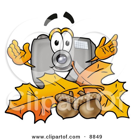 Clipart Picture of a Camera Mascot Cartoon Character With Autumn Leaves and Acorns in the Fall by Mascot Junction