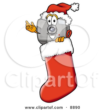 Clipart Picture of a Camera Mascot Cartoon Character Wearing a Santa Hat Inside a Red Christmas Stocking by Mascot Junction