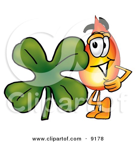Clipart Picture of a Flame Mascot Cartoon Character With a Green Four Leaf Clover on St Paddy's or St Patricks Day by Mascot Junction