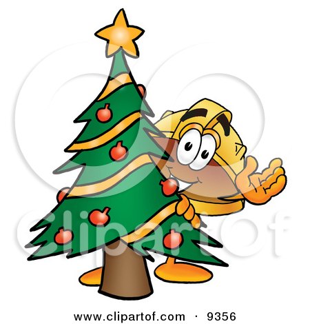 Clipart Picture of a Hard Hat Mascot Cartoon Character Waving and Standing by a Decorated Christmas Tree by Mascot Junction