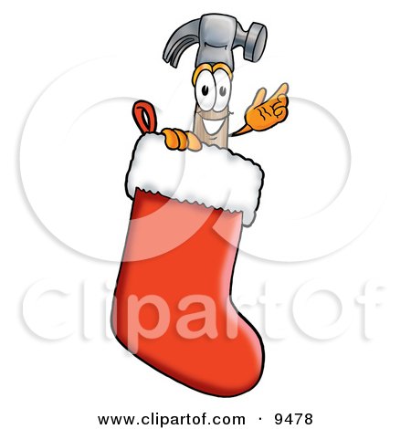 Clipart Picture of a Hammer Mascot Cartoon Character Inside a Red Christmas Stocking by Mascot Junction