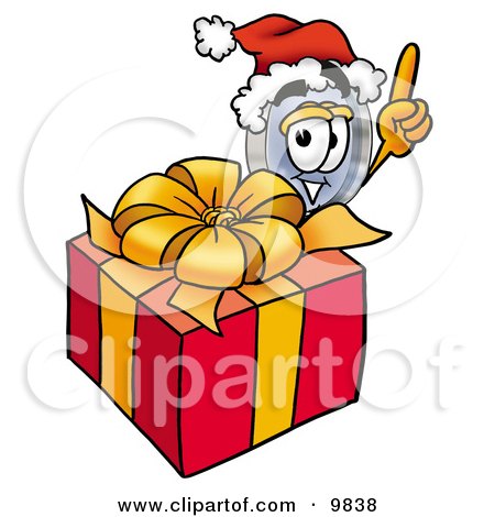 Clipart Picture of a Magnifying Glass Mascot Cartoon Character Standing by a Christmas Present by Mascot Junction