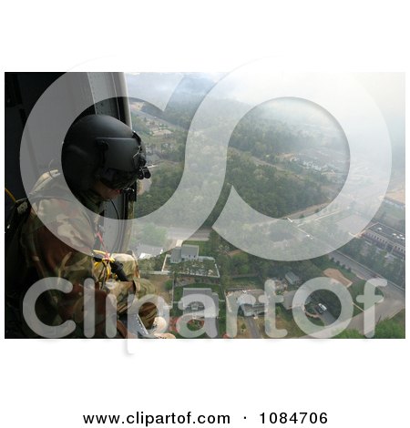 Soldier Overlooking a City From a Helicopter - Free Stock Photography by JVPD