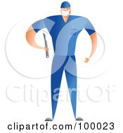 Male Surgeon In Blue Scrubs Holding A Scalpel