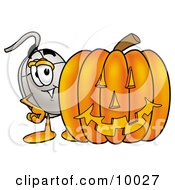 Computer Mouse Mascot Cartoon Character With A Carved Halloween Pumpkin by Mascot Junction