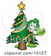 Poster, Art Print Of Dollar Sign Mascot Cartoon Character Waving And Standing By A Decorated Christmas Tree